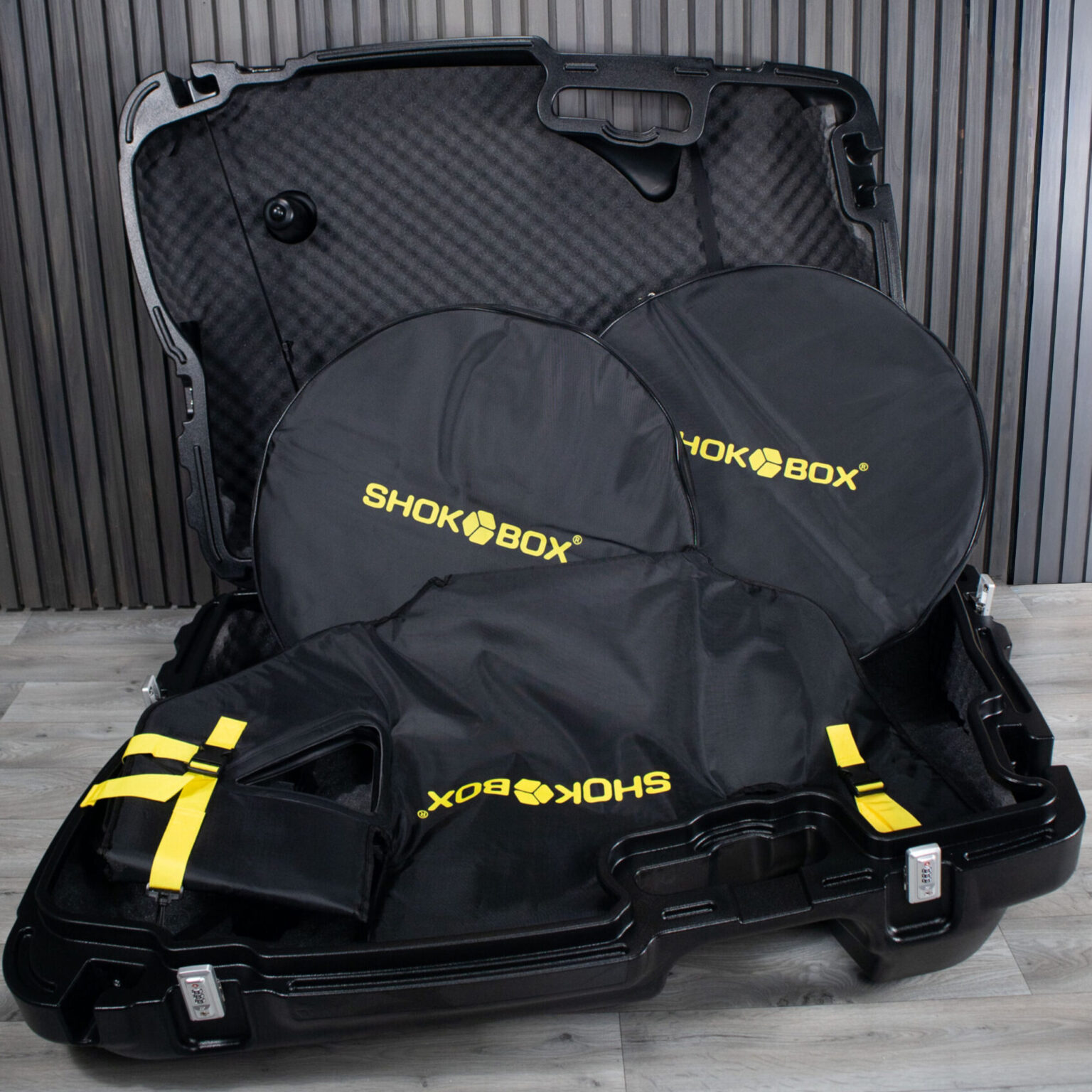 ShokBox Pro open, showing padded wheel bags, frame bag and foam-lined shell